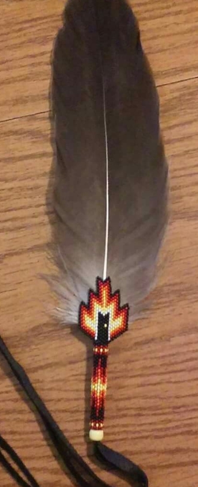 Bead wrapped feather with tassels